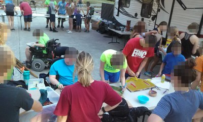 Wheelchair acessible RPG Trailer prototype at Muscular Dystrophy Association MDA summer camp, RPG Research volunteers providing adaptive role-playing games (tabletop and live-action (LARP)), shield-making/decorating, and adaptive drumming.