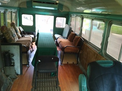 RPG Bus Interior with tables, chairs.